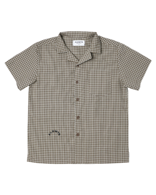Checkered shirt with brand label on a white background