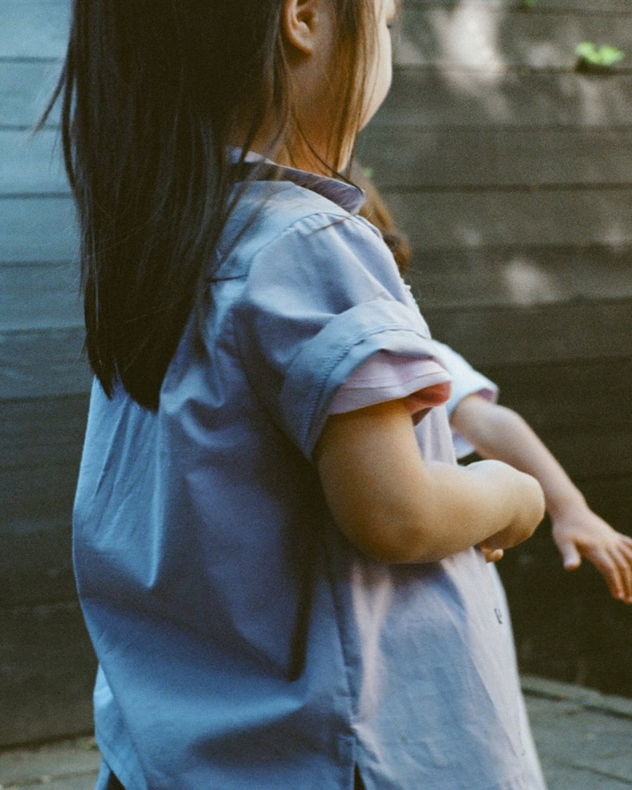 Young girl in purple shirt